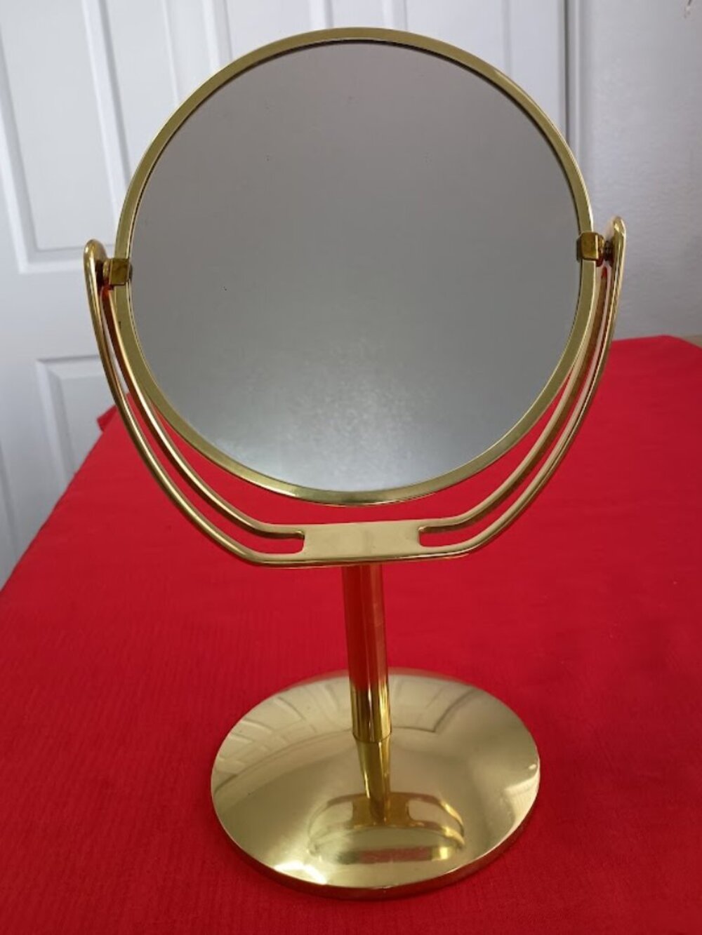 Vintage Brass Vanity Mirror Approximately 13.75" high and 6" across the Base